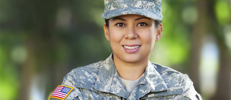 Woman in military uniform smiling